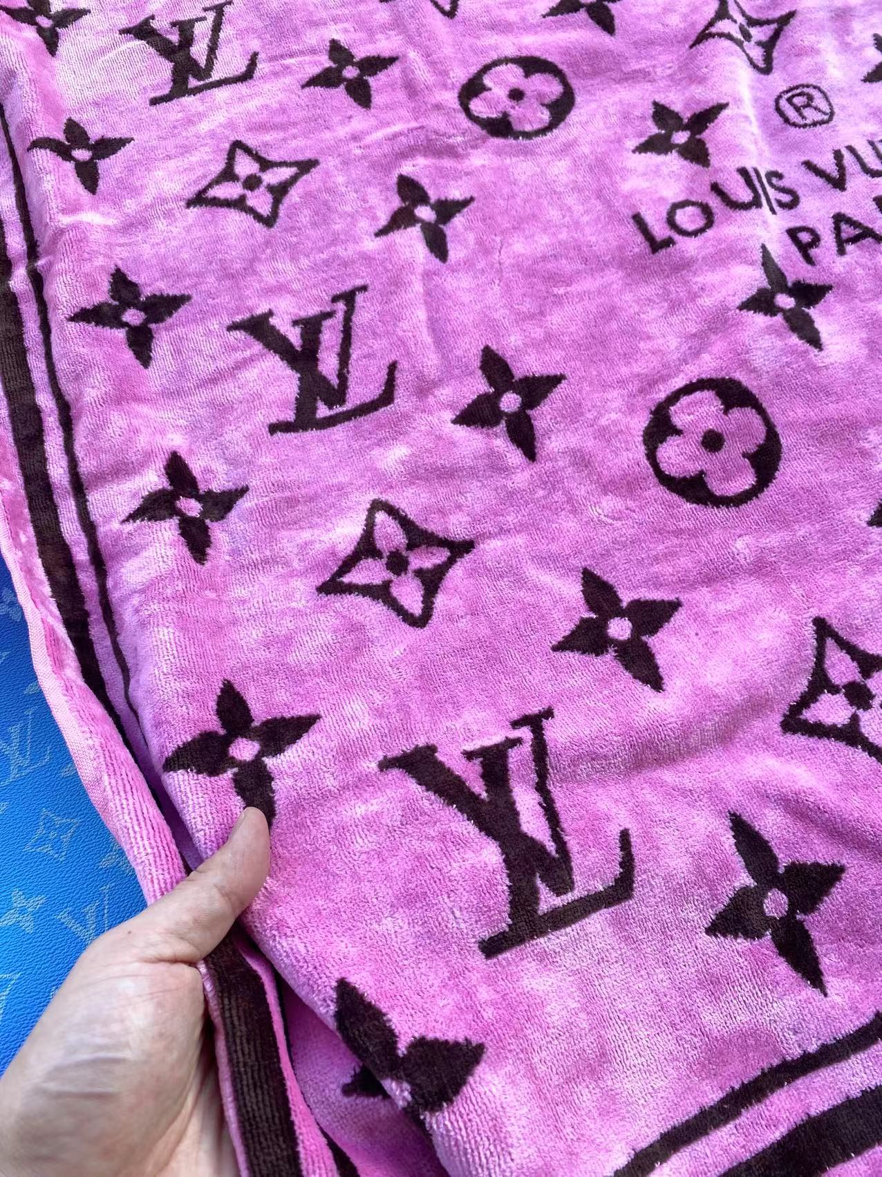 Pink beach towel with black Louis Vuitton monogram pattern 